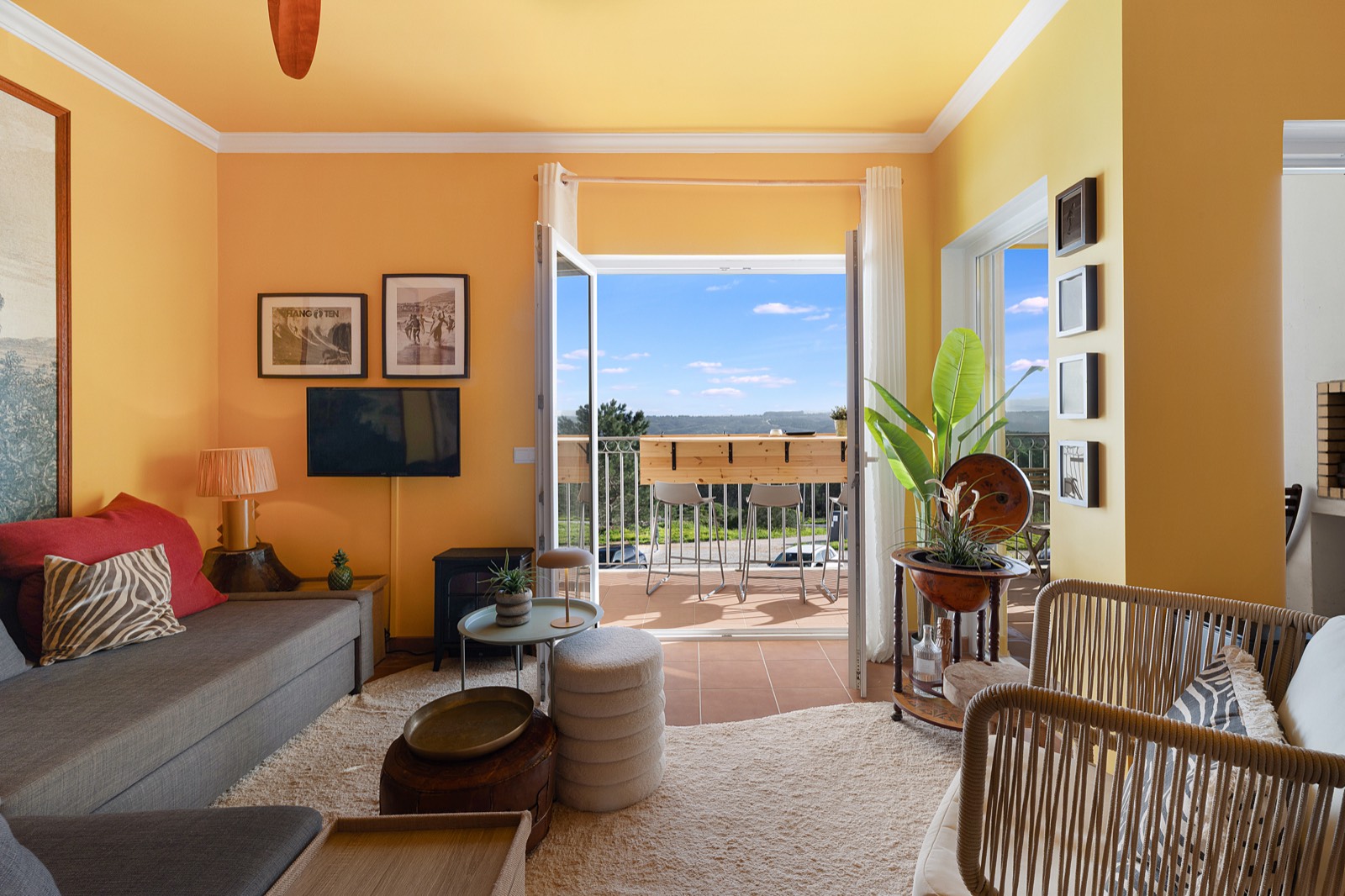Warm interior opening to the balcony