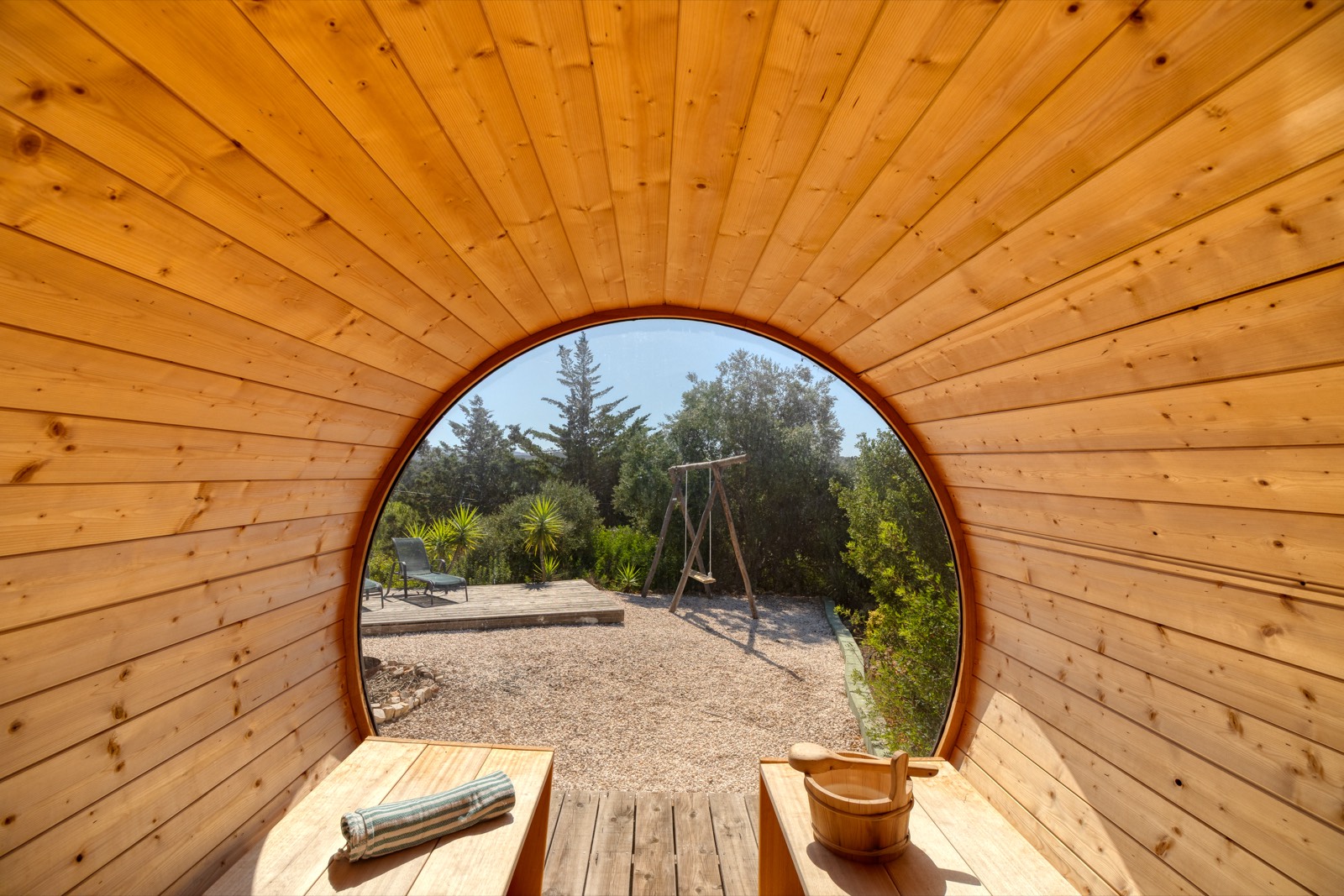 Round window framing the garden